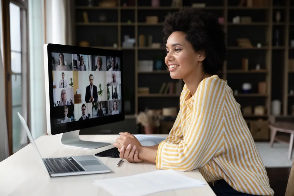 Happy,African,American,Remote,Employee,Talking,On,Video,Conference,Call consultant working