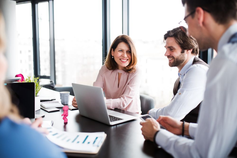 consultants smiling at table