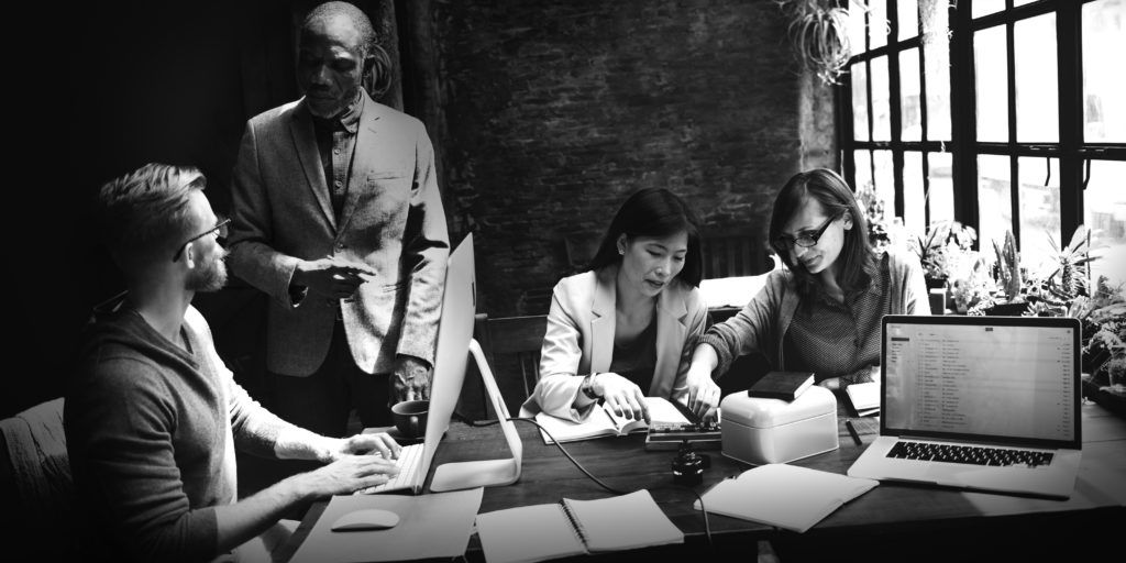 shutterstock_339645692 consultants working at desk