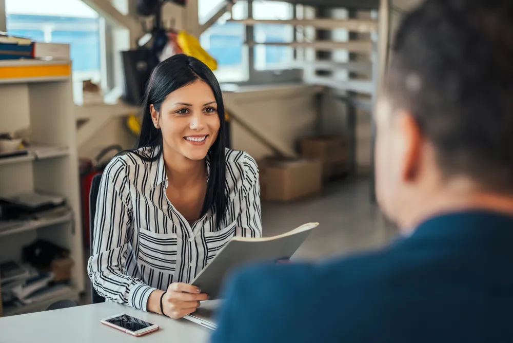 Woman,Consultant,Talking,With,Client,In,Office. consultant