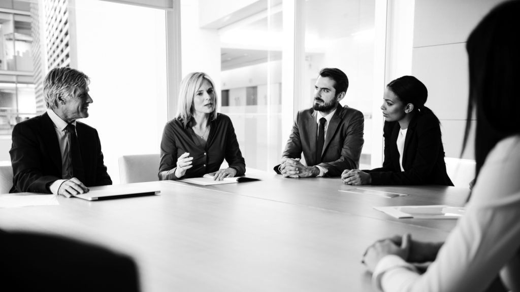 professional consultants in group working at desk