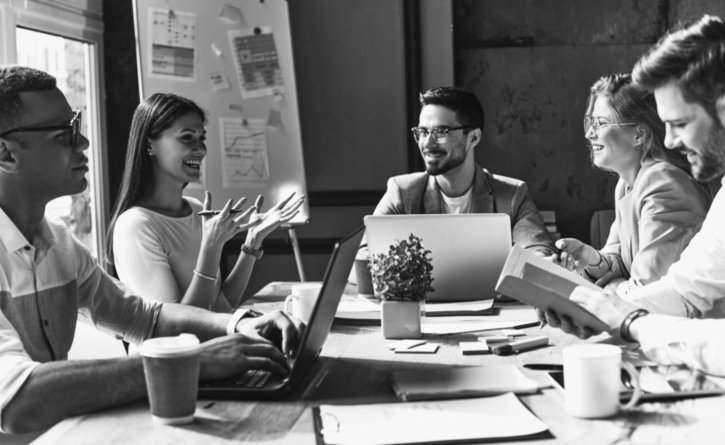 group of people talking at table