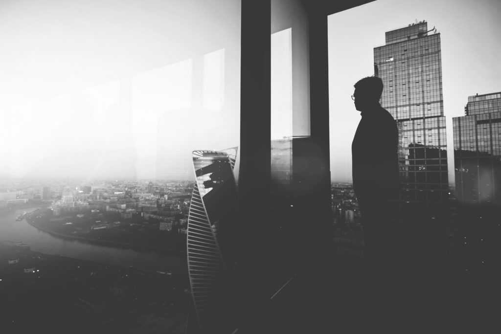 shutterstock_735144454-bw man staring out window