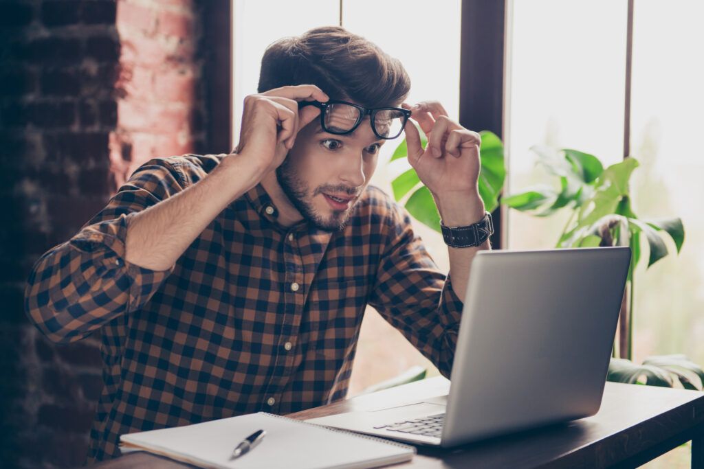 Unbeliveable!,Young,Shocked,Surprised,Man,In,Glasses,Looking,On,Laptop.