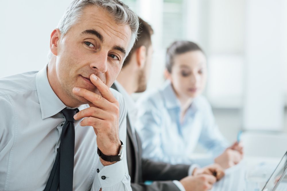 Confident,Professional,Business,Man,Smiling,At,Camera,,Office,And,Business