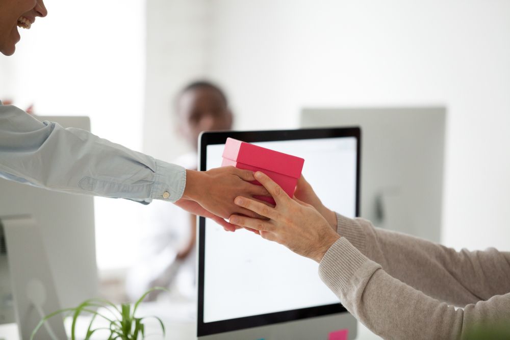 Close,Up,Of,Smiling,Office,Worker,Congratulating,Colleague,With,Birthday,