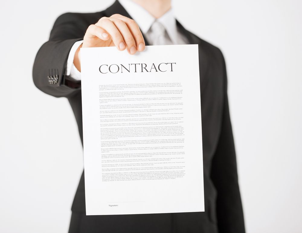 Picture,Of,Man,Hands,Holding,Contract,With,Random,Text
