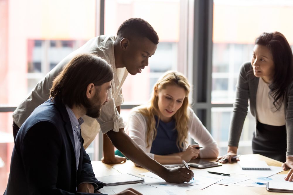 Employee is analyzing results with his colleagues