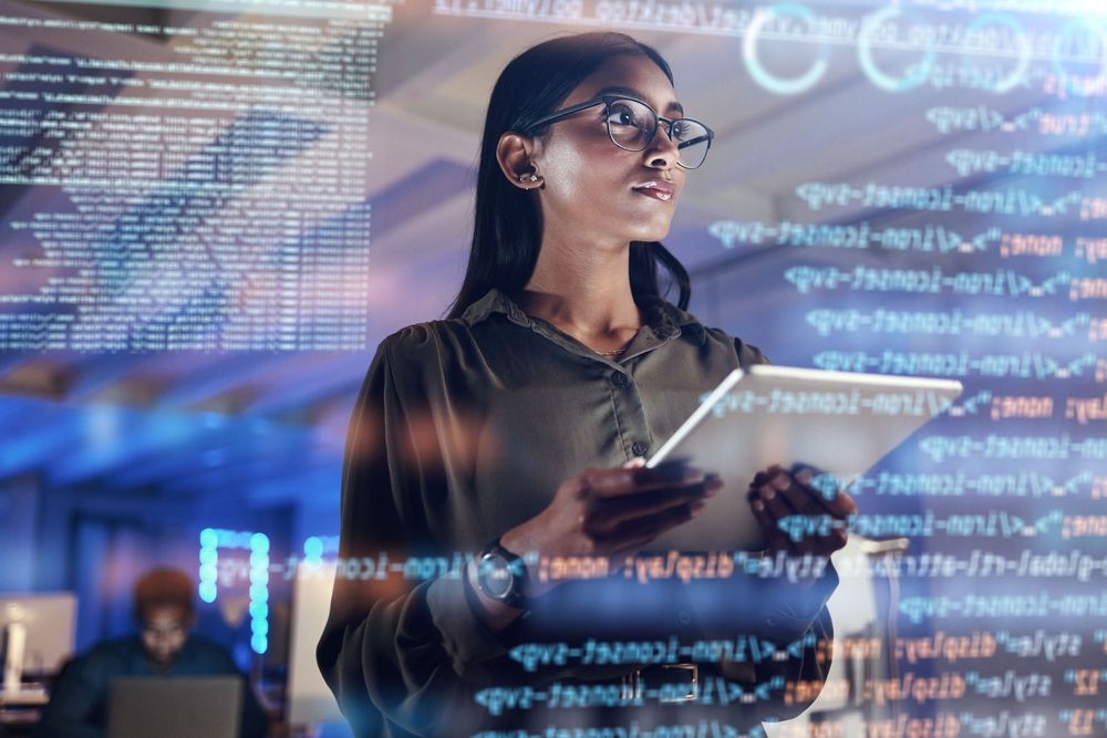 Woman standing with a tablet looking at data